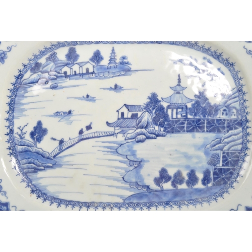 88 - An 18th Century ceramic Chinese blue and white plate portraying oriental scene of lake, bridges, che... 