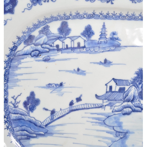 88 - An 18th Century ceramic Chinese blue and white plate portraying oriental scene of lake, bridges, che... 