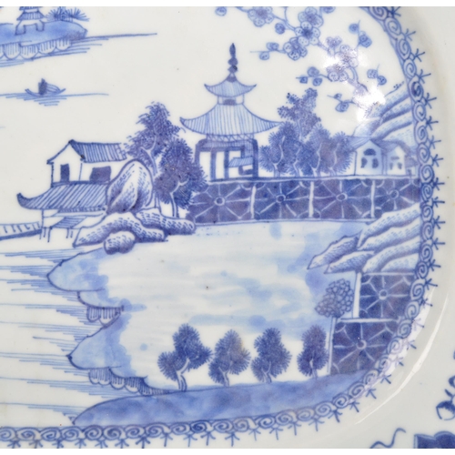 88 - An 18th Century ceramic Chinese blue and white plate portraying oriental scene of lake, bridges, che... 