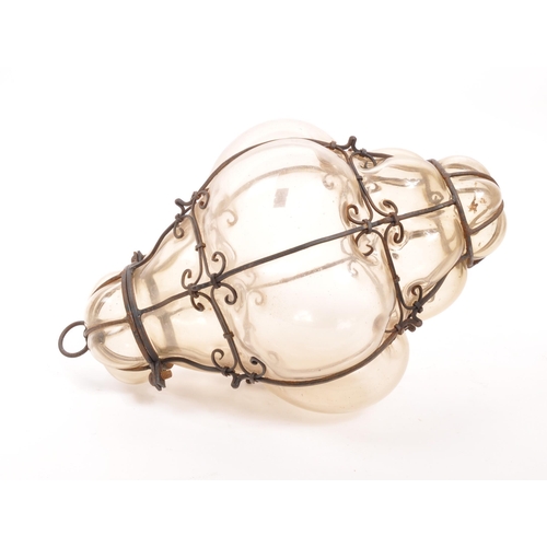 89 - A mid 20th century blown glass ceiling light. Hand blown with caged / imprisoned glass with metal wi... 