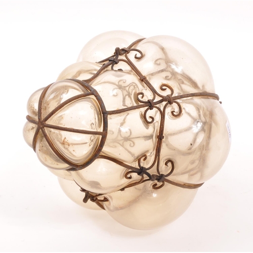 89 - A mid 20th century blown glass ceiling light. Hand blown with caged / imprisoned glass with metal wi... 