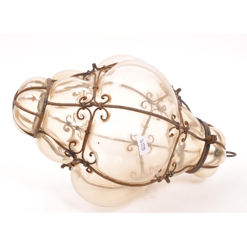 89 - A mid 20th century blown glass ceiling light. Hand blown with caged / imprisoned glass with metal wi... 