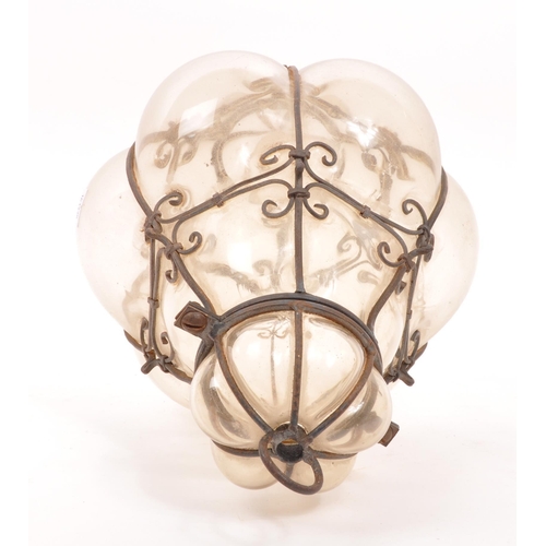 89 - A mid 20th century blown glass ceiling light. Hand blown with caged / imprisoned glass with metal wi... 