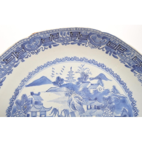 91 - A 19th Century Chinese porcelain blue and white bowl with oriental / willow pattern design to centre... 