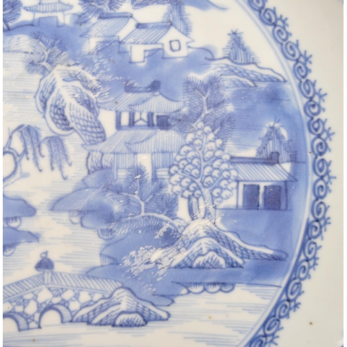 91 - A 19th Century Chinese porcelain blue and white bowl with oriental / willow pattern design to centre... 