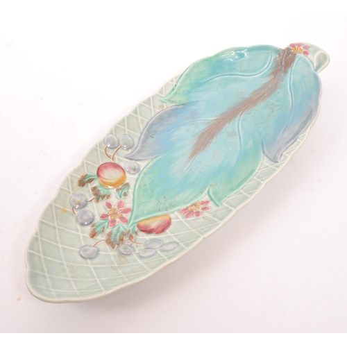 93 - Clarice Cliff - Newport Pottery, England - A vintage 20th century ceramic pottery leaf plate / dish.... 