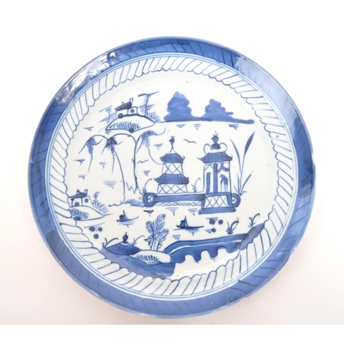 95 - An 18th Century Chinese porcelain blue and white plate of circular form with hand painted oriental l... 