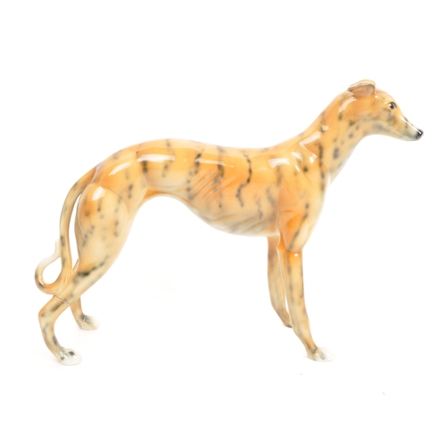 90 - Beswick / Royal Doulton style - A 20th Century vintage ceramic greyhound / whippet figure in the sty... 