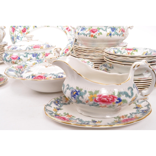 128 - Booths / Royal Doulton - A 20th Century ceramic Booths dinner service in the Floradora pattern with ... 