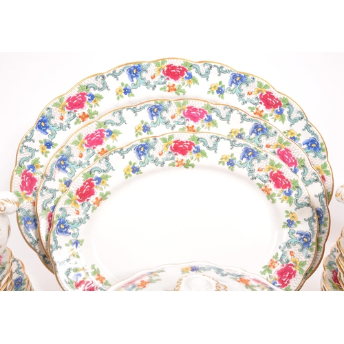 128 - Booths / Royal Doulton - A 20th Century ceramic Booths dinner service in the Floradora pattern with ... 