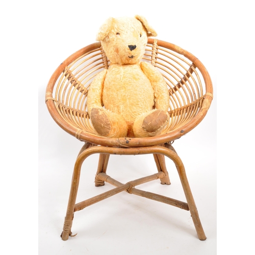 293 - A small 20th Century vintage bamboo bowl child's chair with teddy bear resident.