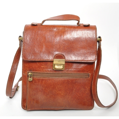 301 - The Bridge - A 20th century leather satchel side bag. The bag having shoulder strap, and handle to t... 