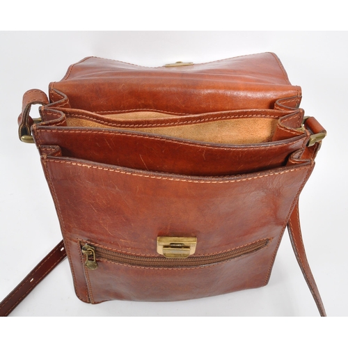 301 - The Bridge - A 20th century leather satchel side bag. The bag having shoulder strap, and handle to t... 