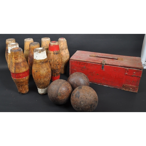 438 - A collection of 20th century wooden pub skittles and balls. The collection to include a set of seven... 