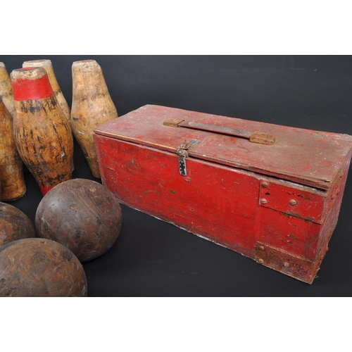 438 - A collection of 20th century wooden pub skittles and balls. The collection to include a set of seven... 