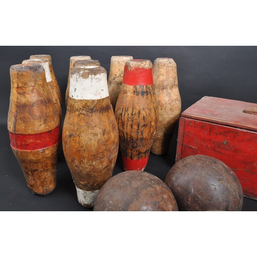 438 - A collection of 20th century wooden pub skittles and balls. The collection to include a set of seven... 