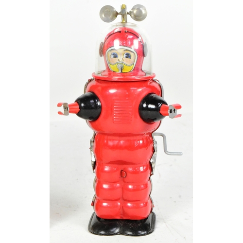 405 - Tinplate Toys - a vintage Japanese Cragstan Astronaut robot. Featuring clear plastic helmet with spi... 