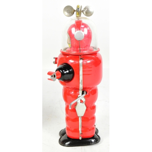 405 - Tinplate Toys - a vintage Japanese Cragstan Astronaut robot. Featuring clear plastic helmet with spi... 