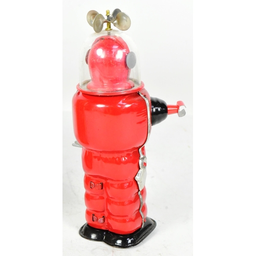 405 - Tinplate Toys - a vintage Japanese Cragstan Astronaut robot. Featuring clear plastic helmet with spi... 