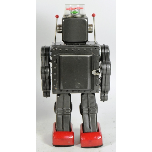 406 - Tinplate Toys - a vintage Japanese (Horikawa) tinplate battery operated Fighting Robot. Moving arms,... 