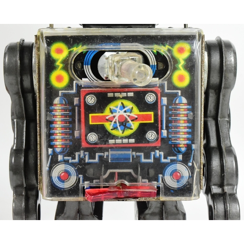 406 - Tinplate Toys - a vintage Japanese (Horikawa) tinplate battery operated Fighting Robot. Moving arms,... 