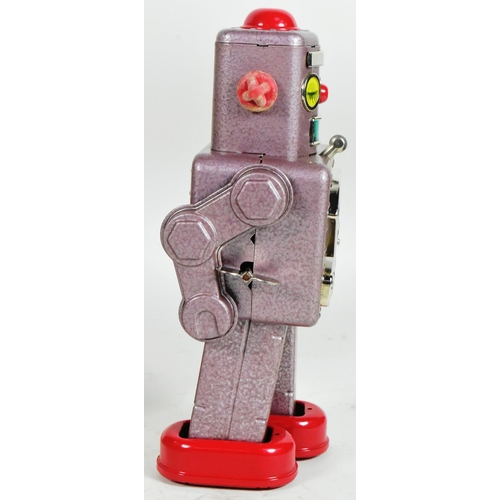 419 - Tinplate Toys - a vintage Japanese mechanical Winky Robot, No. 101. Tested, in excellent, working co... 