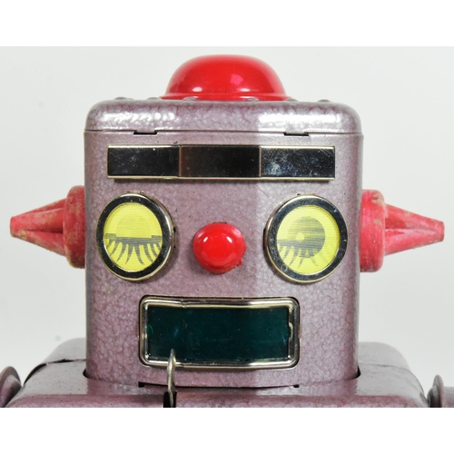 419 - Tinplate Toys - a vintage Japanese mechanical Winky Robot, No. 101. Tested, in excellent, working co... 