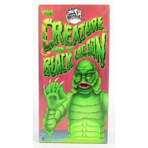 427 - Tinplate Toys - a 1991 Japanese Universal Studios Monsters Creature From The Black Lagoon wind-up ro... 