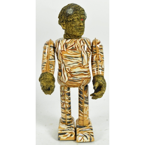 432 - Tinplate Toys - a 1991 Japanese Universal Studios The Mummy wind-up robot. Tested, in excellent, wor... 