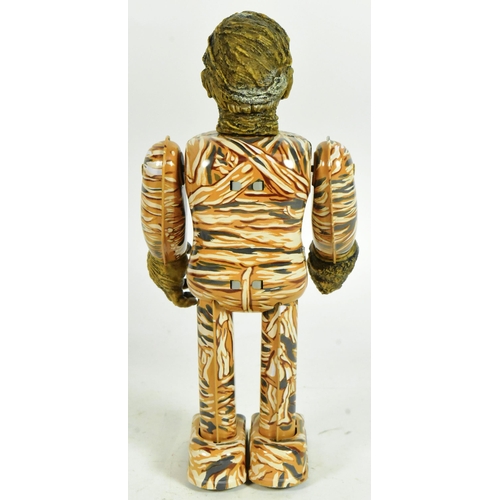 432 - Tinplate Toys - a 1991 Japanese Universal Studios The Mummy wind-up robot. Tested, in excellent, wor... 