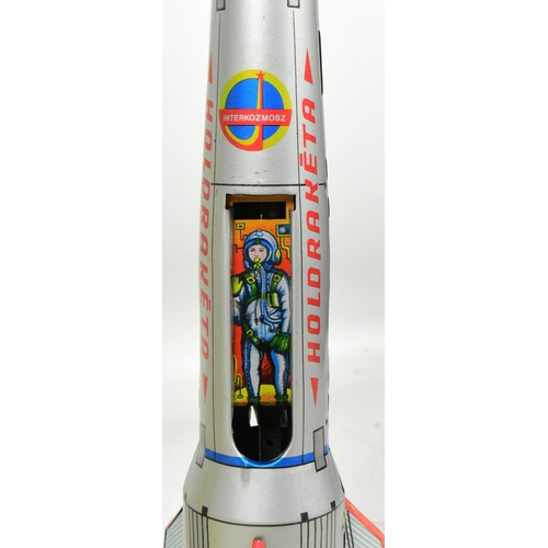 448 - Tinplate Toys - a Hungarian Holdraketa space rocket. All mechanisms working apart from the door open... 