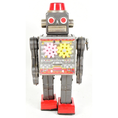 450 - Tinplate Toys - a vintage Japanese SH Horikawa Gear Robot, featuring a sparking helmet, see-through ... 