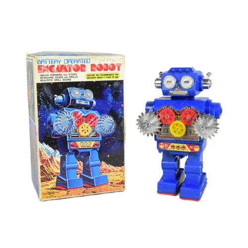 451 - Retro Toys - a vintage Japanese SH battery operated Excavator Robot. Featuring visible gears, revolv... 