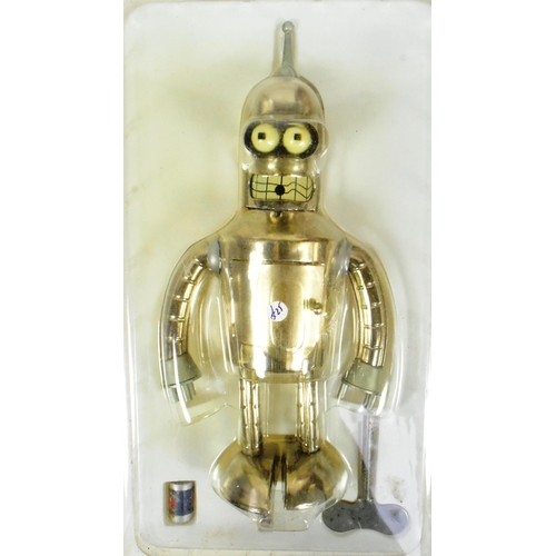 483 - Tinplate Toys - x2 2000 Futurama wind-up robots, comprising of; Bender and Nibbler. Tested and are b... 