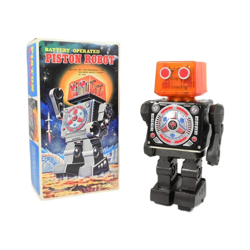 485 - Tinplate Toys - a vintage Japanese SH Horikawa battery operated Piston Robot, featuring see through ... 