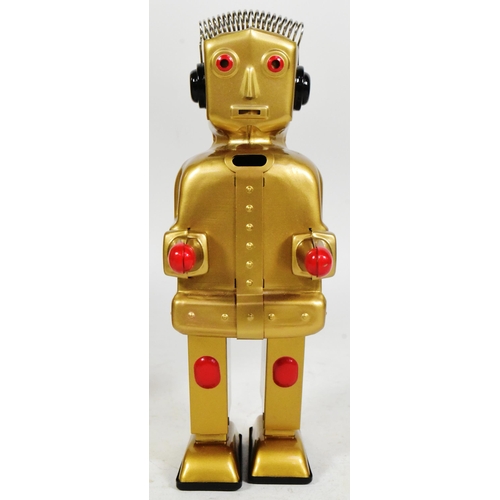 488 - Tinplate Toys - a 2004 Strauss Toys Strenco wind-up robot, in gold. Featuring walking action, and sp... 