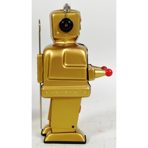 488 - Tinplate Toys - a 2004 Strauss Toys Strenco wind-up robot, in gold. Featuring walking action, and sp... 