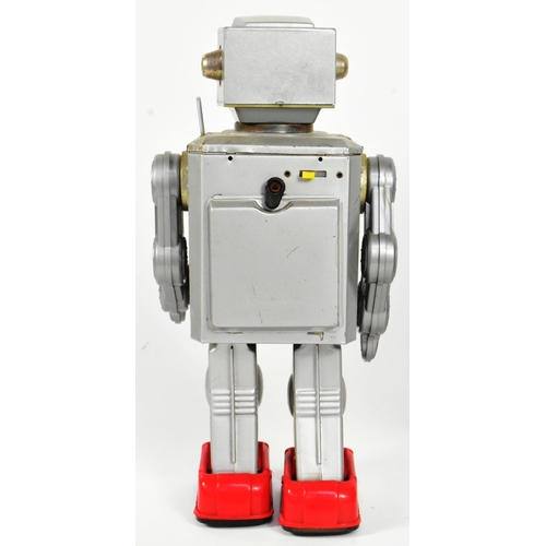 513 - Tinplate Toys - x2 Japanese, believed to be Horikawa space-related robots, featuring a Rotate-O-Mati... 