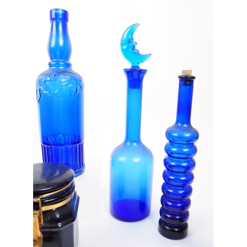 116 - A collection of 20th century Bristol Blue glass. To include bobbin turn glass bud vase / decanter, d... 