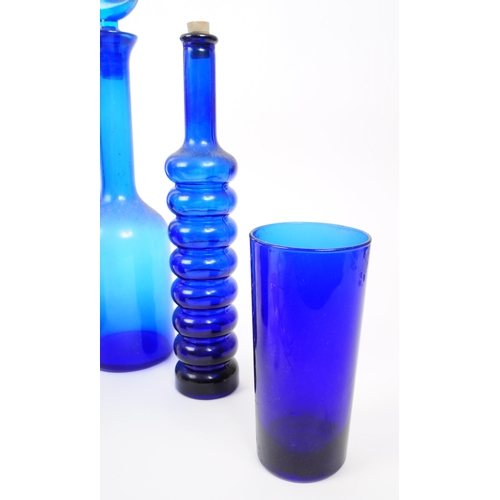 116 - A collection of 20th century Bristol Blue glass. To include bobbin turn glass bud vase / decanter, d... 