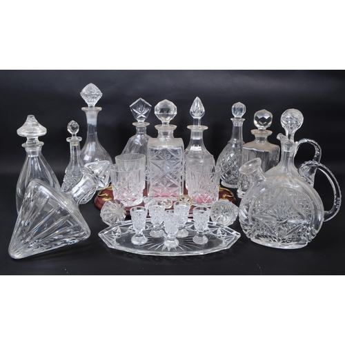 29 - Large collection of vintage 20th century cut glass crystal decanters, some with stoppers and jugs. ... 