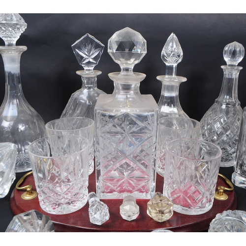 29 - Large collection of vintage 20th century cut glass crystal decanters, some with stoppers and jugs. ... 