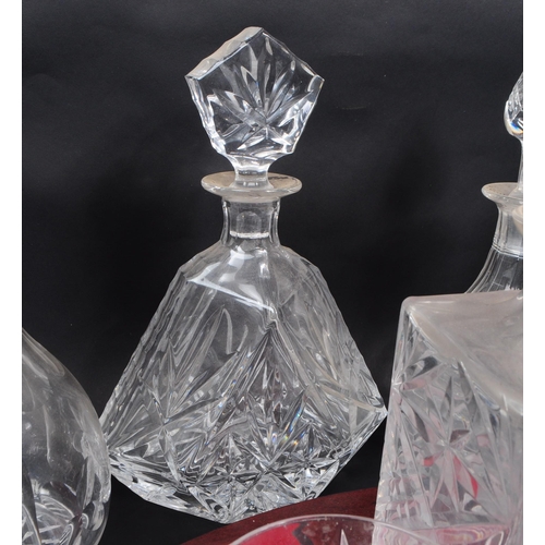 29 - Large collection of vintage 20th century cut glass crystal decanters, some with stoppers and jugs. ... 