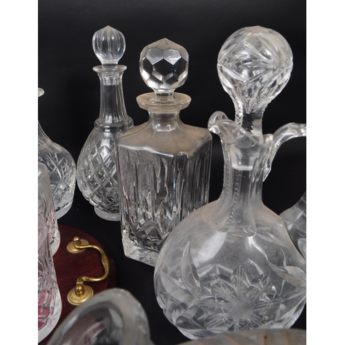 29 - Large collection of vintage 20th century cut glass crystal decanters, some with stoppers and jugs. ... 