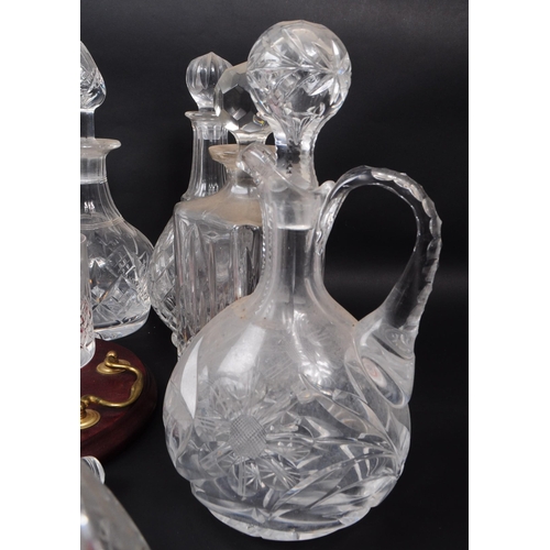 29 - Large collection of vintage 20th century cut glass crystal decanters, some with stoppers and jugs. ... 