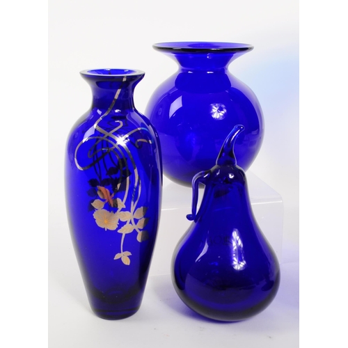 34 - A collection of 20th century Bristol blue glass decorative pieces. The collection containing example... 