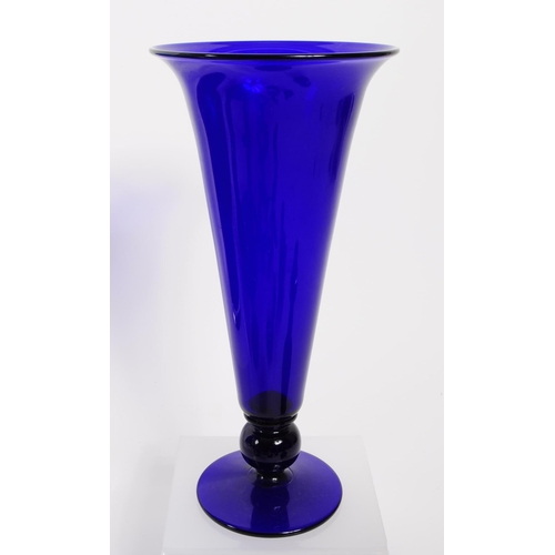 34 - A collection of 20th century Bristol blue glass decorative pieces. The collection containing example... 