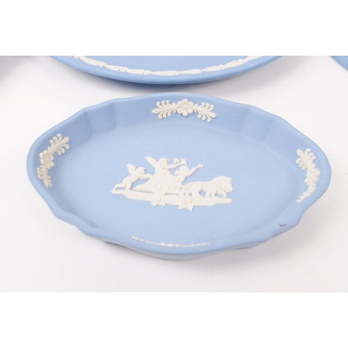 37 - Wedgwood - Jasperware - A collection of porcelain table ware pieces. In the tradional light blue bis... 