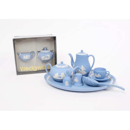 38 - Wedgwood - Jasperware - A vintage 20th century porcelain doll's tea service set. Including teapot, c... 