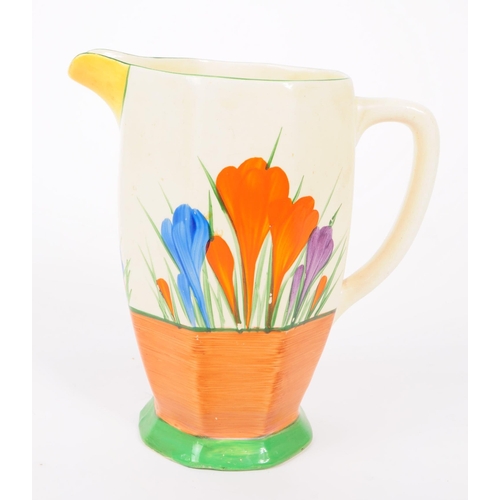 5 - Clarice Cliff - A mid 20th century Clarice Cliffe Bizzare Crocus jug. The jug having a white ground,... 